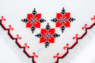 part of embroidered serviette by cross-stitch pattern