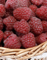 Red raspberries in the wicker basket