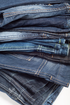 stack of denim blue jeans