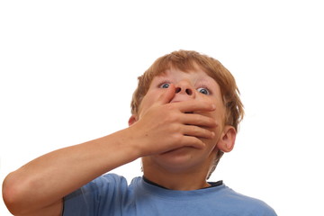 Boy covers his mouth