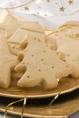 Assorted Christmas biscuits in a golden plate.