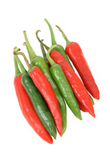 Green and red chillis on white background