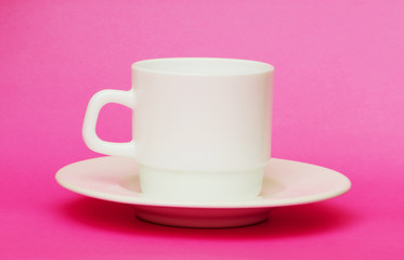 White cup isolated on the colourful background