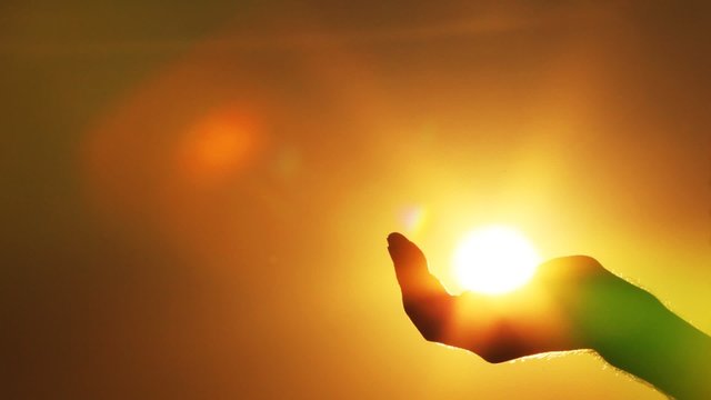the hand touches the sun