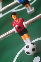 Fototapeta premium Table Football Player Kicking Ball