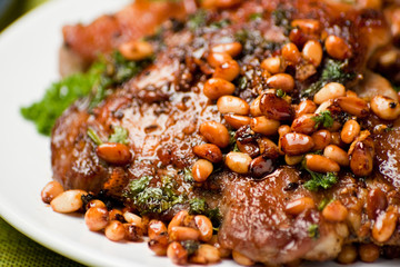Pork chop with cedar nutlets