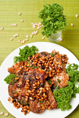 Chops from pork with cedar nutlets (top view)