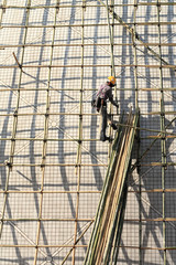 Fototapeta premium building a scaffold with bamboo in Hong Kong