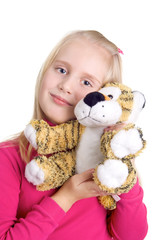 portrait of girl with a toy tiger isolated on white