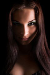 Young beautiful woman's dramatic light portrait