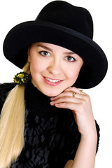 Portrait of young woman in dark hat - white background