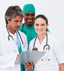 Portrait of medical team taking notes