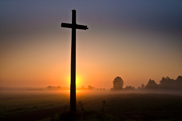 cross against the setting sun