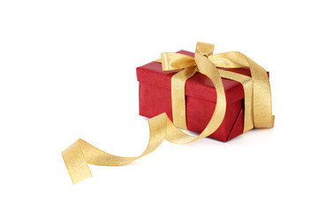 Red gift box with gold bow on  white background