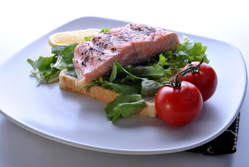 smoked organic wild salmon steak with toast and salad