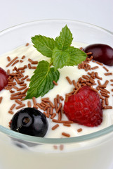 some organic summer fruit in yogurt and mint