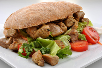 home made bread roll with organic pork goulash