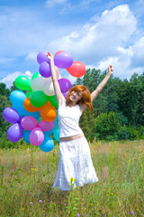 Woman playing with balloons