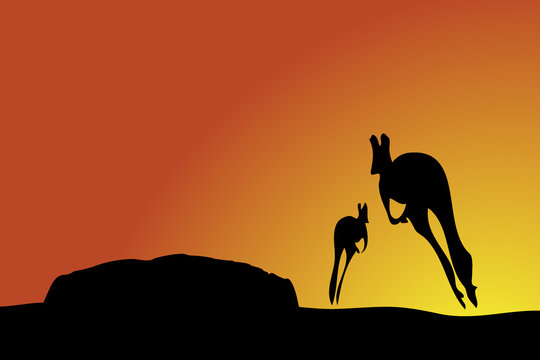 Kangaroos jumping towards Uluru