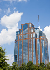 Blue Sky and White Clouds in Brick and Glass Building