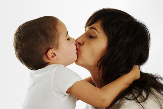 Mother and son kissing