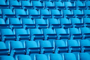 Empty folding blue stadium seating.