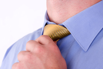businessman adjusting his neck tie