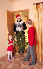 happy family with christmas tree