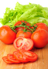 Ripe red tomatoes with lettuce