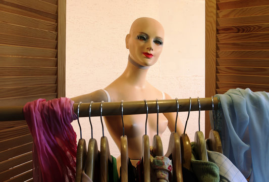 figurine look at clothes