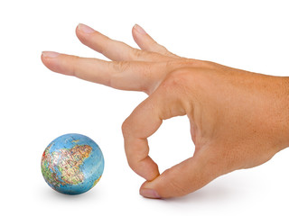 small globe and hand