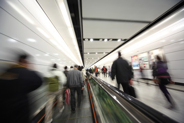 People walking in corridor, blurred motion