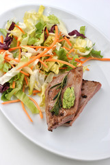 grilled beef with organic vegetable on a plate