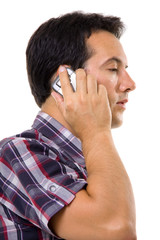 Young casual man on the phone isolated on white