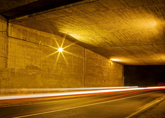 Night traffic under a bridge, long exposure