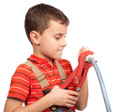 Cute kid posing as a plumber