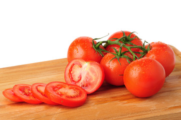 Ripe red tomatoes on white background.