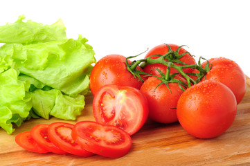 Ripe red tomatoes with lettuce.