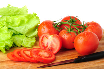 Ripe red tomatoes with lettuce.