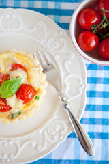 Small pie with brie and tomatoes