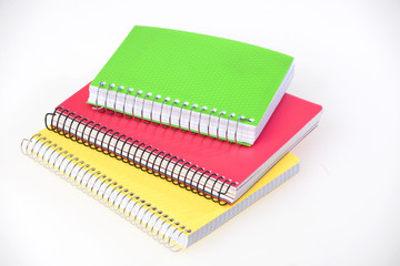 Colorful notebooks on a white background