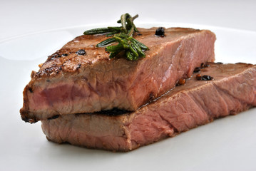 grilled rump steak with organic rosemary on a plate