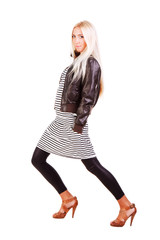 Fototapeta premium Young sweet girl in jacket and striped dress