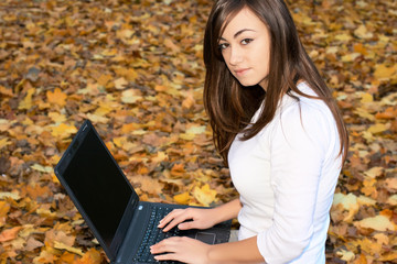 teenager girl using laptop