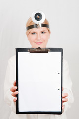 Young female doctor with folder. copy-space