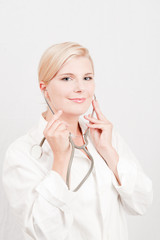 Young female doctor with medical stethoscope