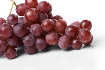 Red ripe grape on the white background