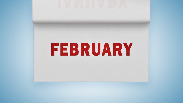 Turning pages on white paper calendar