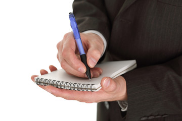 Businessman writing notes