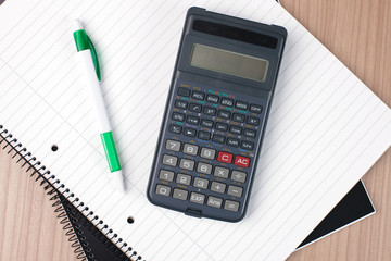 calculator,pen and notebook